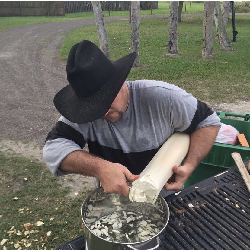 Todd Keller cooking on a grill outdoors