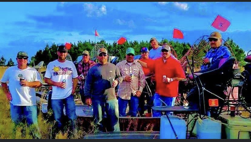 Todd Keller with friends on a boat