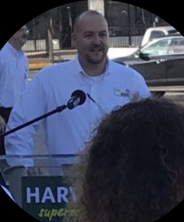 Todd Keller speaking at a podium