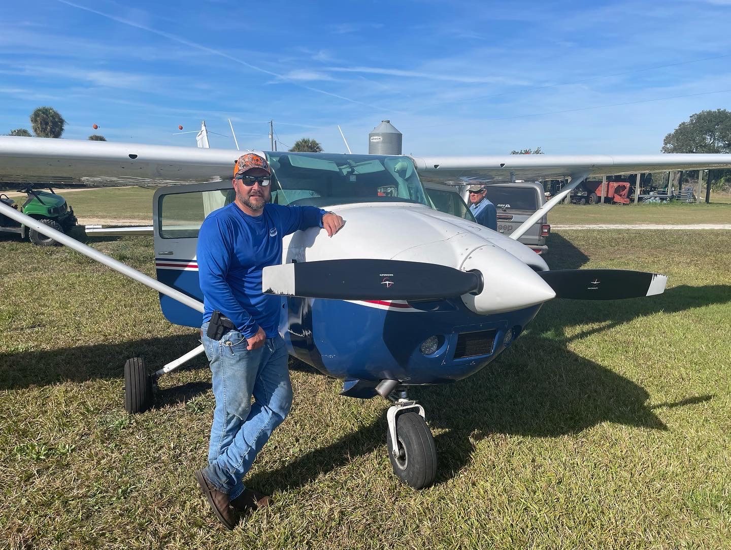 Todd Keller next to a small airplane