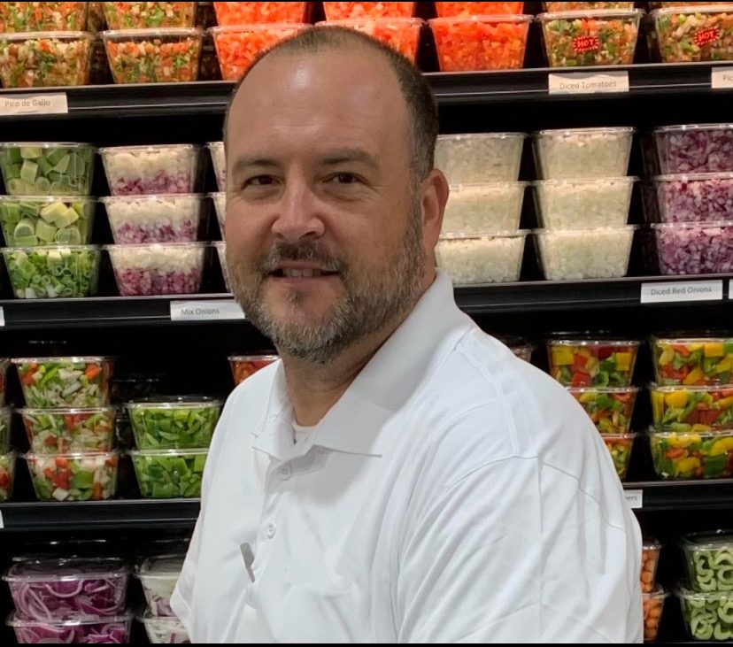 Todd Keller in the produce department during his Winn-Dixie career